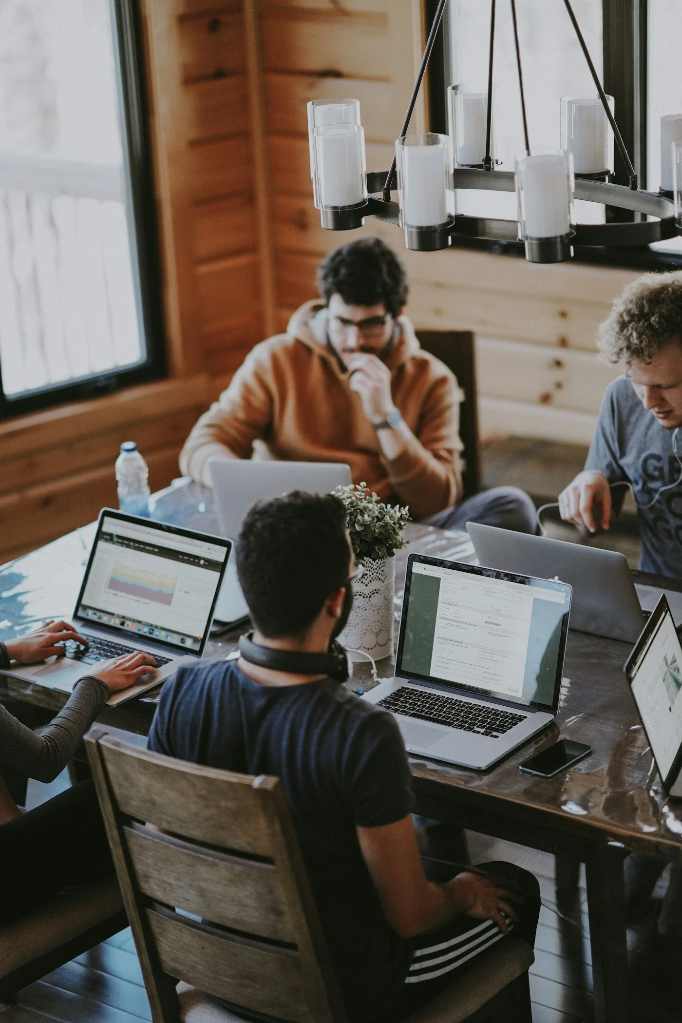 Colleagues working together around a table in a naturally lit office